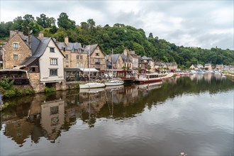 Houses and boats on the Rance river in Dinan medieval village in French Brittany