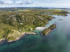 Aerial view of the Ross of Mull peninsula and the fishing village of Fionnphort in the picture on the right