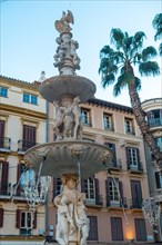 Water fountain in the Plaza de la Constitucion in the city of Malaga