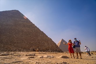 A couple in the pyramid of Cheops the largest pyramid. The pyramids of Giza the oldest funerary monument in the world. In the city of Cairo