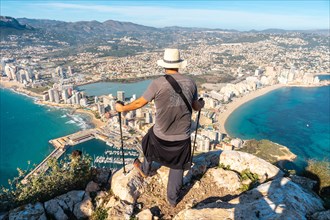 A young hiker at the top of the Penon de Ifach Natural Park in Calpe