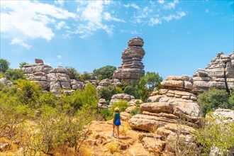 Trekking in the Torcal de Antequera on the green and yellow trail walking along the path
