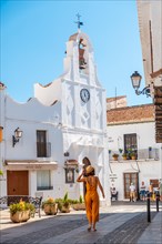 A tourist in Mijas in the white houses charming town in the province of Malaga