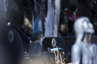 Angel figure on a grave in a cemetery