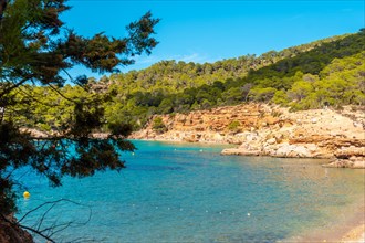 Tourists on the paradisiacal beaches on the coast of Ibiza
