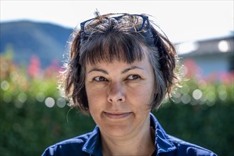 Headshot on a Happy Smiling Woman with Eyeglasses in a Sunny Day in Switzerland