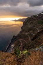 Winding road at Mirador de Cristo Rei at sunset in Funchal in summer
