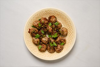 Plate with minced meat meatballs with green pea and cranberry jam