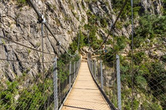 Suspension bridges in the Loriguilla reservoir. Ruta de los Pantaneros in the town of Chulilla in the Valencian community. Spain