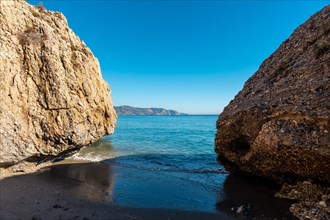 Detail of the sea in the small coves on Calahonda beach in the town of Nerja