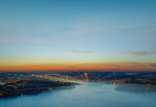 Aerial View in Long Exposure over Illuminated City of Lucerne and Lake Lucerne in Dusk in Lucerne