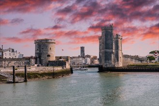 The beautiful entrance with the towers of the fort in La Rochelle. Coastal town in southwestern France