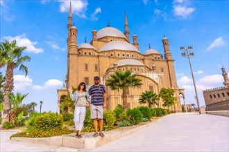 A couple of European tourists visit the Alabaster Mosque in the city of Cairo