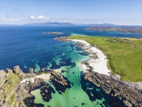 Aerial view of Traigh An T-Suidhe sandy beach on the north side of the Isle of Iona