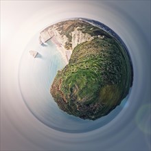Sightseeing panoramic view to the Falaise d'Aval limestone cliffs as a micro planet in space. La Manche waters and continental side of Etretat