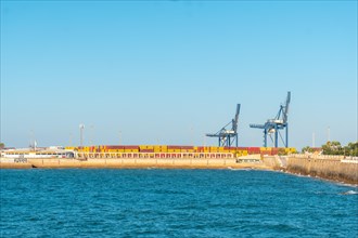 Commercial maritime and industrial cargo port with cranes from the city of Cadiz. Andalusia