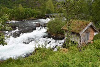 Cottage by a watercourse in Norway
