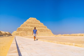 A young man walking in the Stepped Pyramid of Djoser