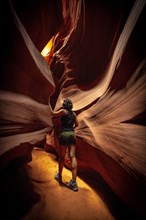 A young woman admiring the beauty of the Upper Antelope Canyon in the town of Page