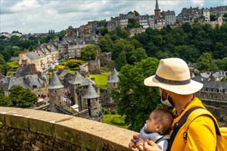 A young tourist girl visiting Fougeres castle in the covid-19 pandemic. Brittany region