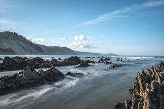 Long exposure Geopark in Sakoneta on the coast of Deba among rocks. Basque Country