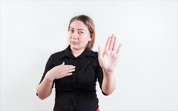 Young woman rejecting with the palm of hand isolated. People gesturing stop isolated. Latin girl gesturing stop with palm hand isolated