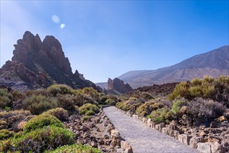 Beautiful path between the Roques de Gracia and the Roque Cinchado in the natural area of Teide in Tenerife