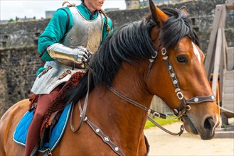 A medieval soldier on horseback at the castle of Fougeres. Brittany region