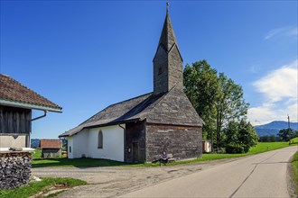 Chapel of St. Nicholas and St. Magdalena with many wooden shingles in Linsen near Niedersonthofen