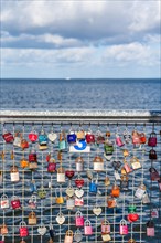 Love locks on the pier at the Utkiek viewpoint in the fishing village of Wieck