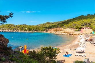 Tourists on the paradisiacal beaches on the coast of Ibiza