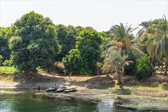 Egyptian local people living on the bank of the river Nile. Views sailing on the cruise on the river Nile from Luxor to Aswer