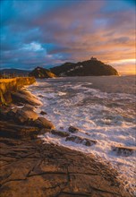 Sunset with waves in the sea of the city of San Sebastian