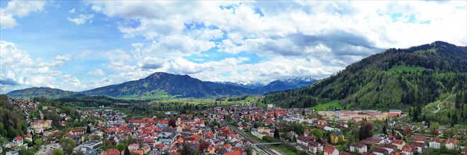 Aerial view of Immenstadt im Allgaeu with a view of the Alps. Immenstadt im Allgaeu