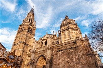 Facade of Santa Iglesia Catedral Primada in the medieval city of Toledo de Castilla La Mancha at sunset