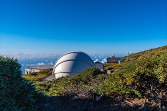 Observatories of the Roque de los Muchachos in the Caldera de Taburiente with a sea of nuts below one summer afternoon