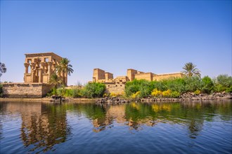 The beautiful temple of Philae and the Greco-Roman buildings seen from the Nile river