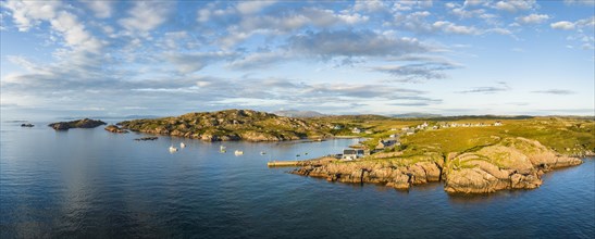 Aerial panorama of the coastline of the Ross of Mull peninsula with the fishing village of Fionnphort