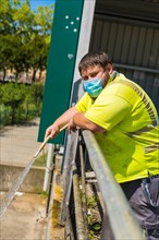 Worker in a recycling factory or clean point and garbage with a face mask and with security protections