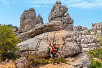 A young father with his son enjoying the Torcal de Antequera on the green and yellow trail