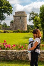 A young mother visiting the Chateau de la Hunaudaye is a medieval fortress