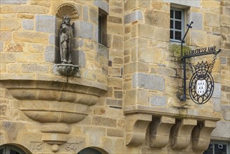 Detail of the facade of the stone house Maison de la Chenechaussee