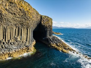 Aerial view of the uninhabited rocky island of Staffa with the prominent basalt columns and Fingal's Cave