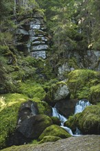 Lohnbachfall with little water and rocks behind