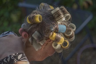 Woman's head with curlers
