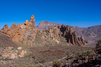 Downhill path in the Roques de Gracia and the Roque Cinchado in the natural area of Teide in Tenerife