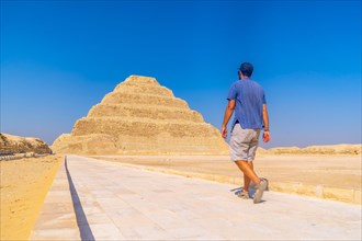 A young man walking in the Stepped Pyramid of Djoser