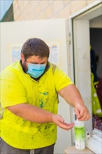 Worker in a recycling factory or clean point and garbage with a face mask and with security protections