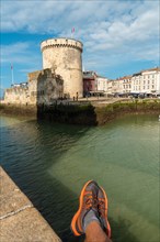 Resting next to The Chain Tower of La Rochelle. Coastal town in southwestern France
