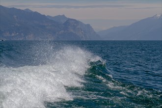 Stern wave of an excursion steamer on Lake Garda